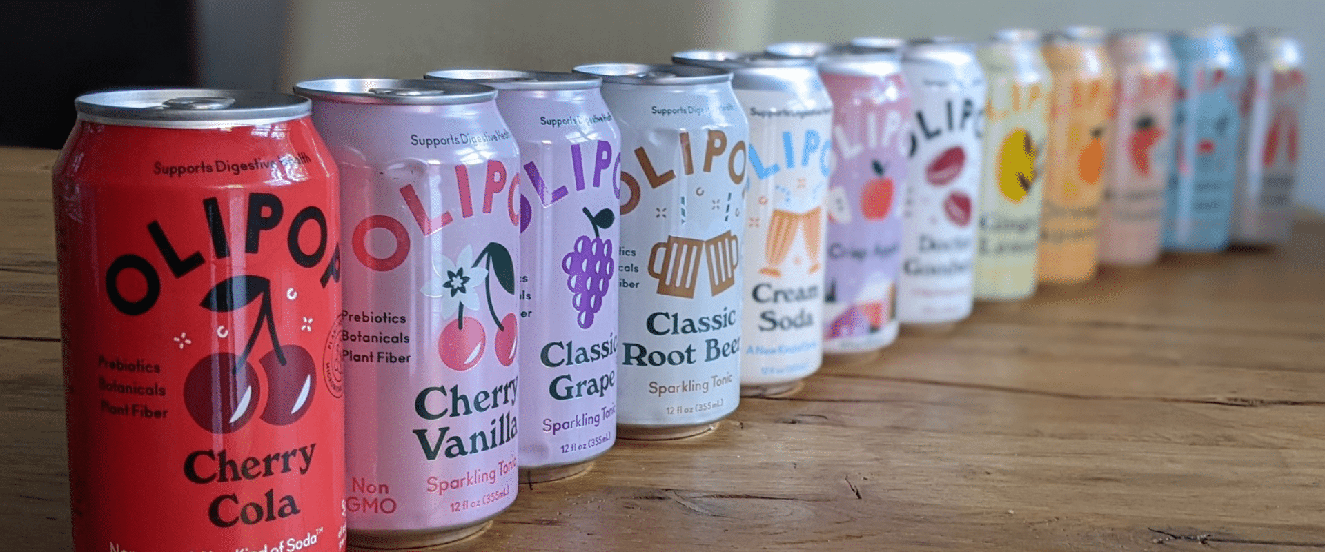 A row of cans lined up on a table.