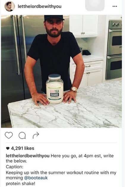 A man is standing next to a jar of protein.