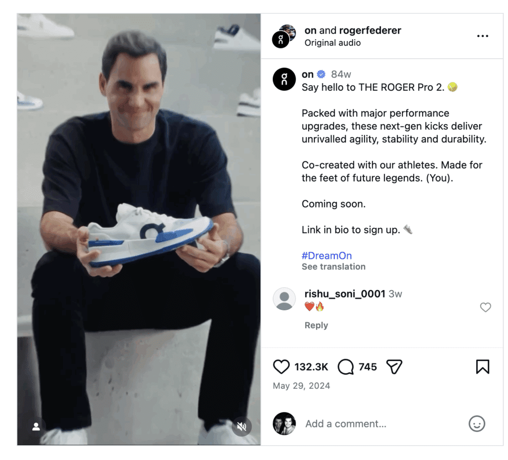 What Is Brand Advocacy? (7 Top Brand Programs Explained) 17 Roger Federer sits holding a white and blue sneaker, showcasing his brand advocacy for the new ROGER Pro 2 tennis shoes in a social media post.