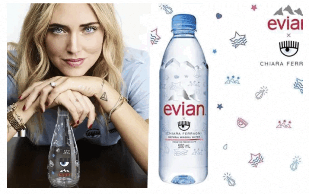 Chiara Ferragni Pandoro Gate: Cleared Of Fraud Charges, But Lost Millions 4 A woman rests her arms on a table beside an Evian water bottle featuring an eye design. Next to her is an Evian bottle and logos for the Evian x Chiara Ferragni collaboration, which recently drew attention amid the Pandoro Gate fraud charges.